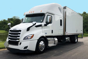 White Freightliner Cascadia 116 Factory Expediter truck parked on the street.